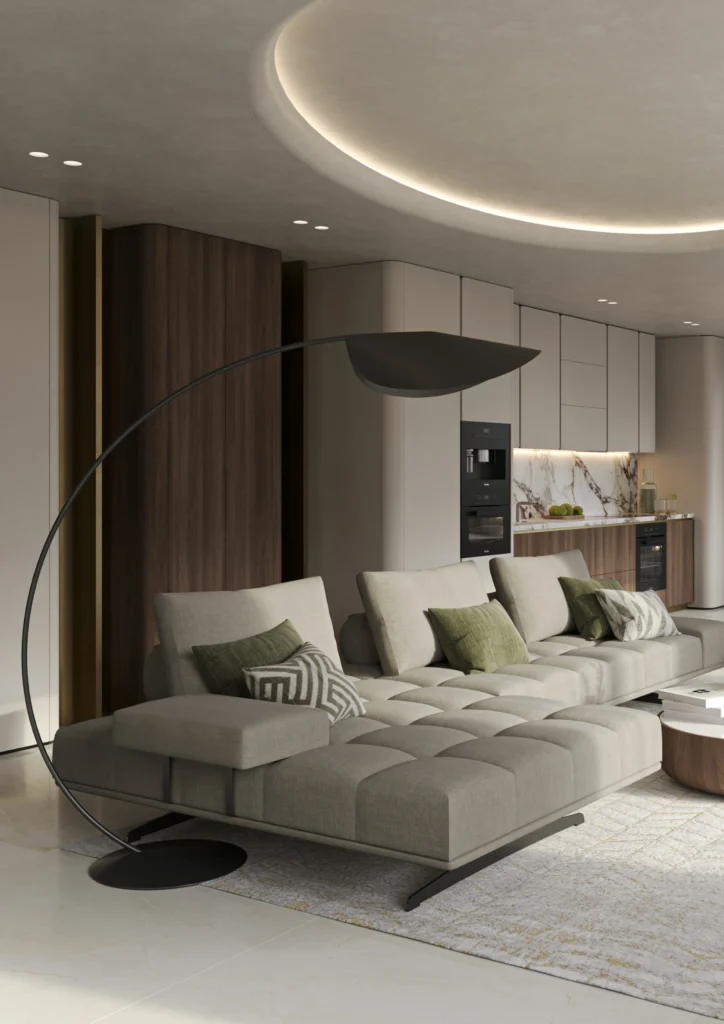 Interior design of a living room ¾ view with gray sofa, green armchair, walnut decor and marble floor in front of the kitchen and dining area.